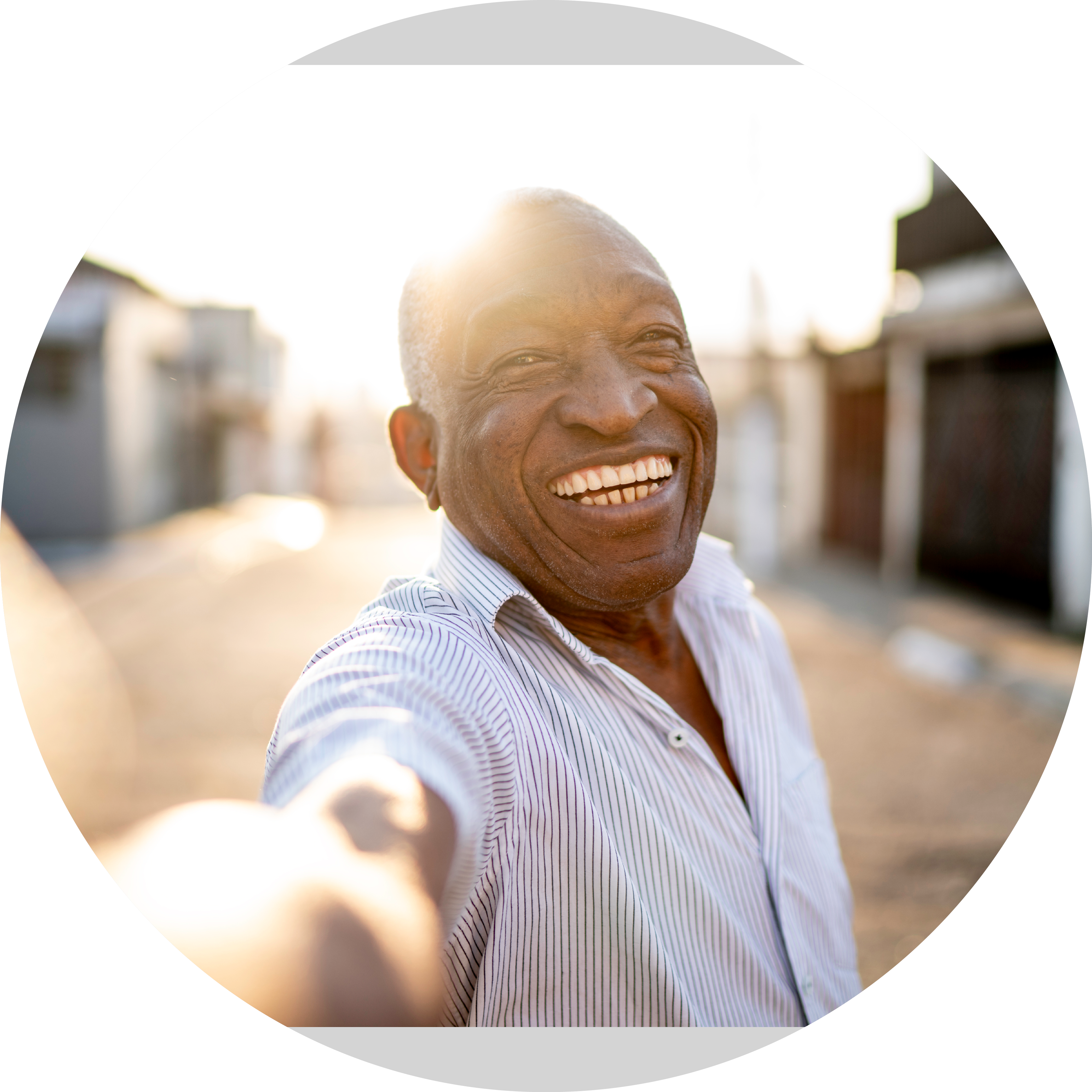 Smiling senior man taking a selfie on the street