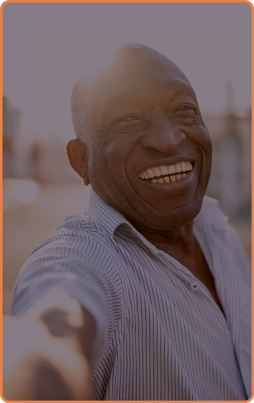 Smiling senior man taking a selfie on the street