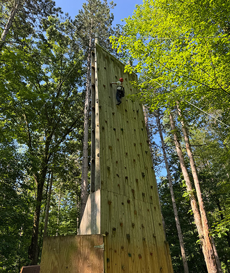 Child climbing rock wall