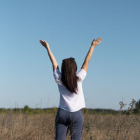 long-shot-woman-looking-sky